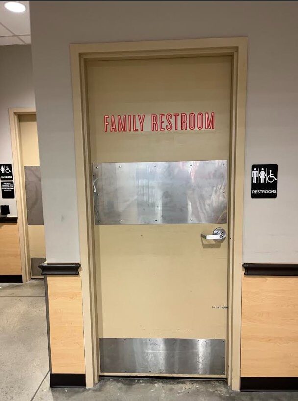 Family restroom door fully hardened with stainless steel kick plate and armor plate